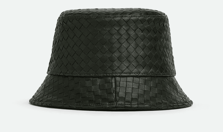 A dark green, woven leather bucket hat with a textured, checkered pattern. The hat has a wide brim and a smooth finish, displayed against a plain background.